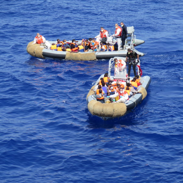 Italian Navy vessel Virginio Fasan, performing search and rescue activities in the Central Mediterranean as part of the Mare Nostrum operation, August 2014. The ship patrolled the central Mediterranean between the Italian island of Lampedusa, Tunisia and Libya. The Italian Navy vessel rescued 1,004 refugees and migrants on 14 August 2014. Using two rubber dinghies, a dozen people at a time were transferred to the Fasan. Families were transferred first. Some arrived barefoot, some children were shaking with cold. Men, women and children from Syria, Somalia, Gambia, Bangladesh and other countries were rescued. They were all disembarked in the port of Naples on 15 August 2014.